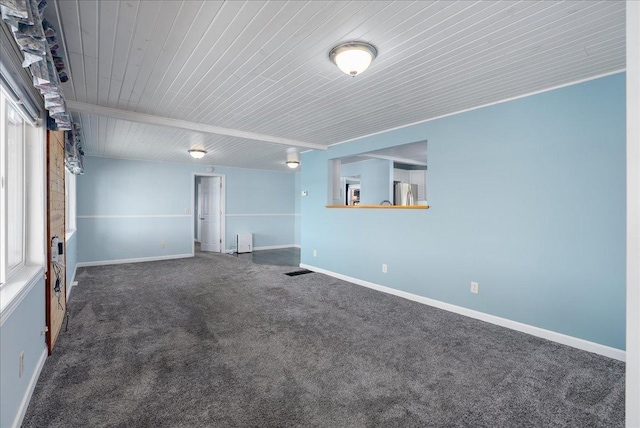 773 US Highway 63, Clayton, WI 54004 - carpeted empty room with wooden ceiling and baseboards