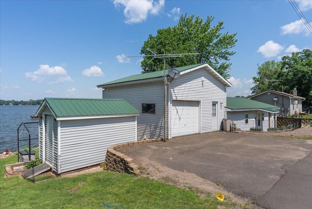 773 US Highway 63, Clayton, WI 54004 - detached garage with asphalt driveway and a water view