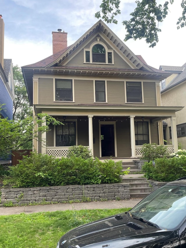 811 Ashland Ave, Saint Paul, MN 55104 - view of front of property featuring covered porch and a chimney