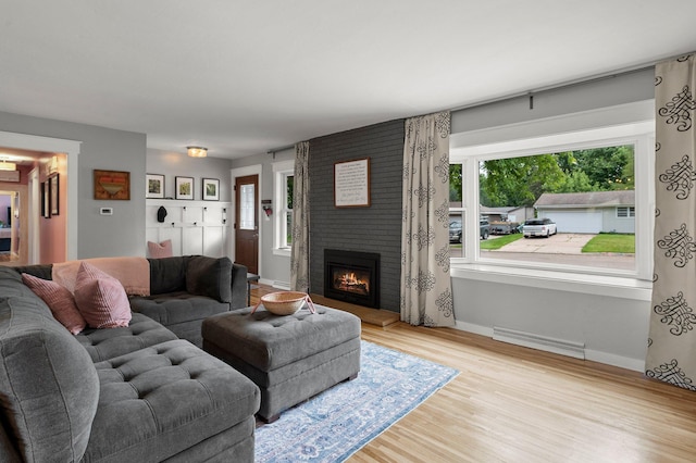771 Creek Ave, Mendota Heights, MN 55120 - living room with healthy amount of natural light, wood finished floors, and a fireplace