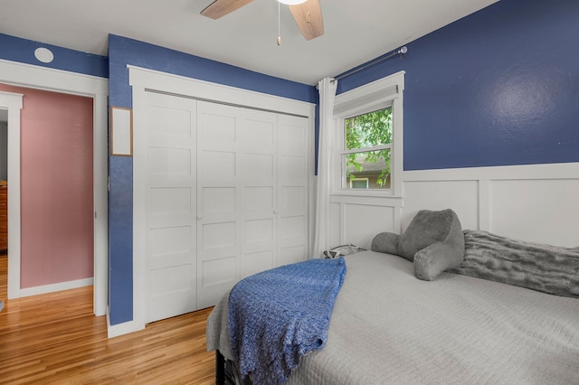 771 Creek Ave, Mendota Heights, MN 55120 - bedroom featuring light wood-type flooring, a closet, a wainscoted wall, and a ceiling fan