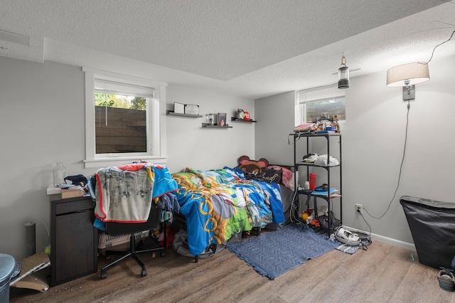 771 Creek Ave, Mendota Heights, MN 55120 - bedroom with wood finished floors and a textured ceiling