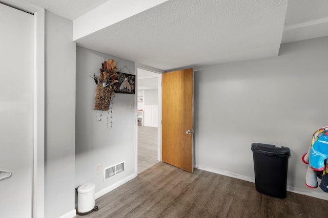 771 Creek Ave, Mendota Heights, MN 55120 - unfurnished room featuring a textured ceiling and wood finished floors