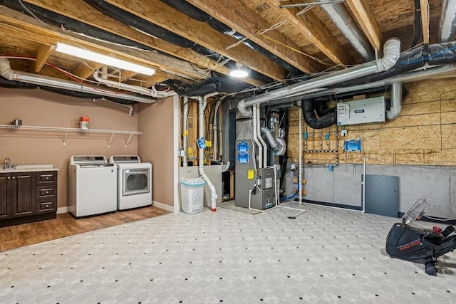 2051 Diamond Ln, Lino Lakes, MN 55038 - unfinished below grade area featuring separate washer and dryer, heating unit, and tile patterned floors