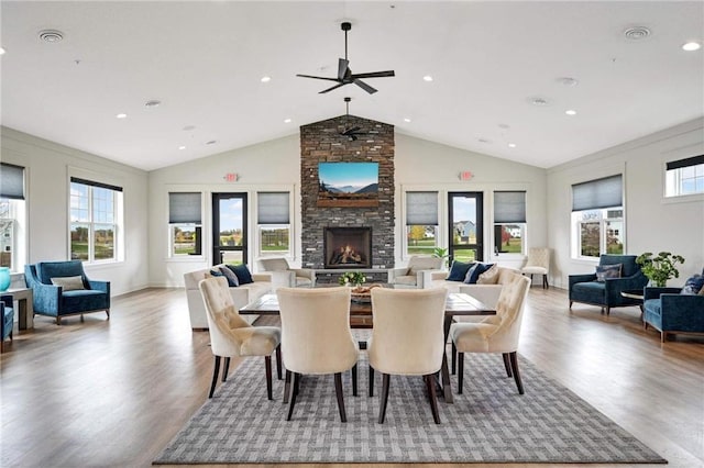2051 Diamond Ln, Lino Lakes, MN 55038 - dining area featuring ceiling fan, wood finished floors, a large fireplace, recessed lighting, and high vaulted ceiling