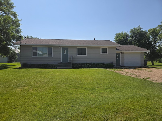 266 6th St, Hancock, MN 56244 - ranch-style home featuring driveway, a garage, and a front lawn