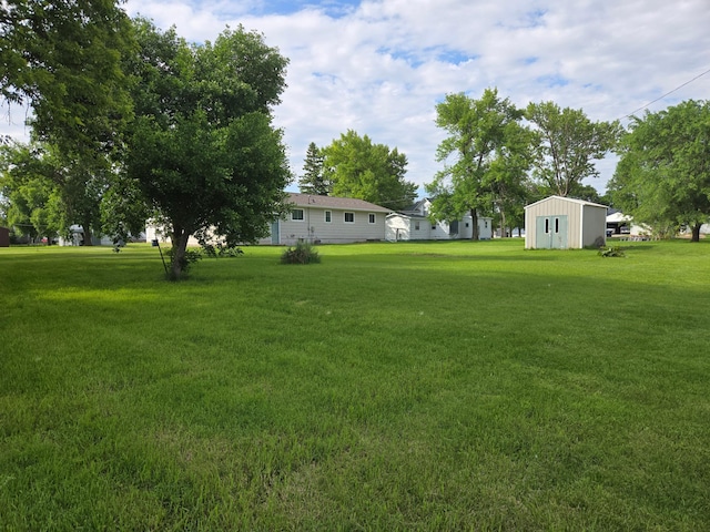 266 6th St, Hancock, MN 56244 - view of grassy yard featuring an outdoor structure