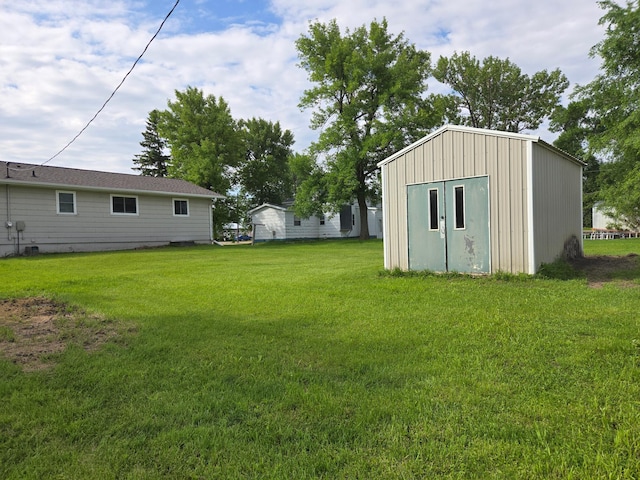 266 6th St, Hancock, MN 56244 - view of grassy yard featuring an outdoor structure
