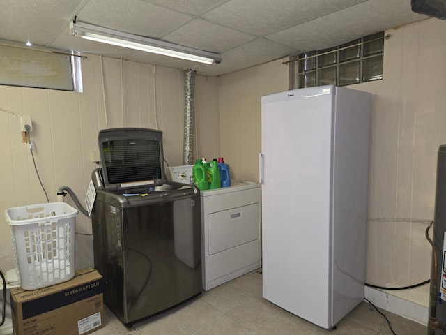 266 6th St, Hancock, MN 56244 - laundry area with independent washer and dryer and light tile patterned floors