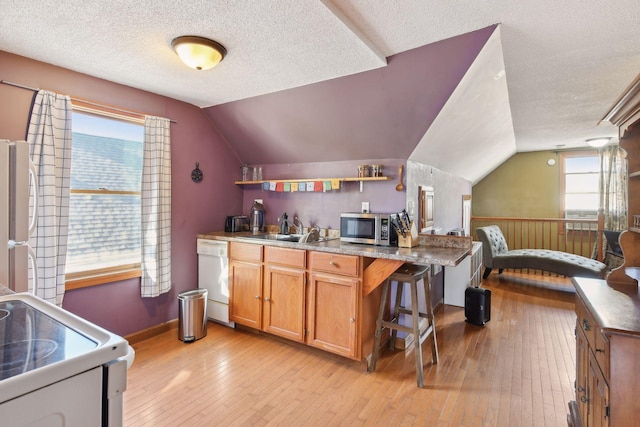 104 27th St, Minneapolis, MN 55408 - kitchen featuring white appliances, vaulted ceiling, open shelves, a textured ceiling, and light wood-type flooring