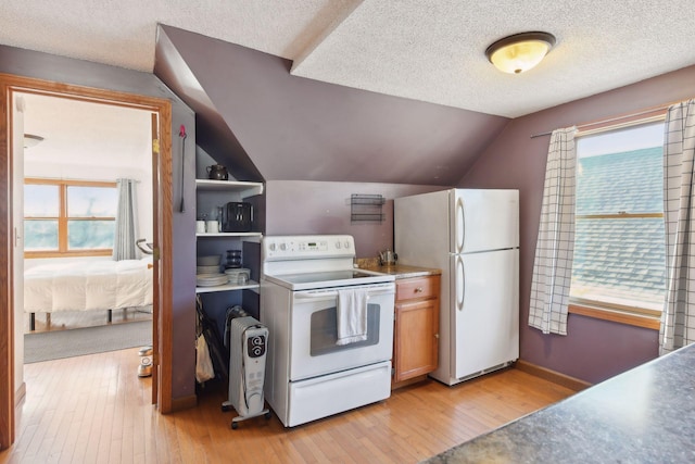 104 27th St, Minneapolis, MN 55408 - kitchen featuring white appliances, light wood-style flooring, vaulted ceiling, a textured ceiling, and brown cabinets