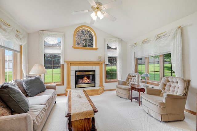6105 Creekview Ln N, Brooklyn Park, MN 55443 - carpeted living area featuring healthy amount of natural light, lofted ceiling, a fireplace, and a ceiling fan
