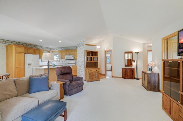 6105 Creekview Ln N, Brooklyn Park, MN 55443 - living room featuring light carpet, vaulted ceiling, and recessed lighting