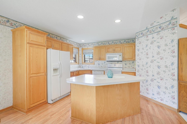 6105 Creekview Ln N, Brooklyn Park, MN 55443 - kitchen with white appliances, light wood-style floors, wallpapered walls, light countertops, and a center island