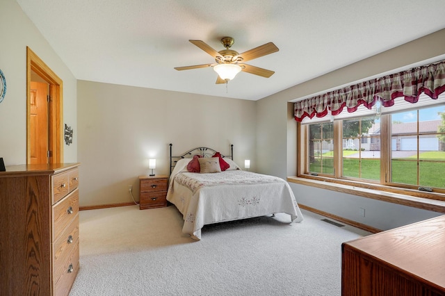 6105 Creekview Ln N, Brooklyn Park, MN 55443 - bedroom with light carpet and a ceiling fan