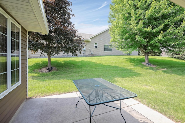 6105 Creekview Ln N, Brooklyn Park, MN 55443 - view of green lawn featuring a patio