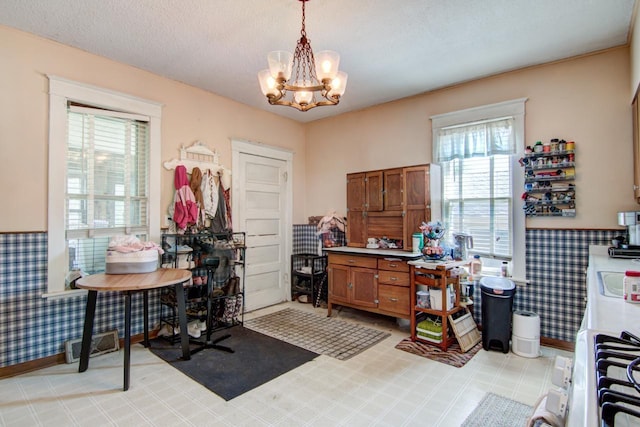 735 Broadway Ave, Wabasha, MN 55981 - office space with healthy amount of natural light, a chandelier, and wallpapered walls