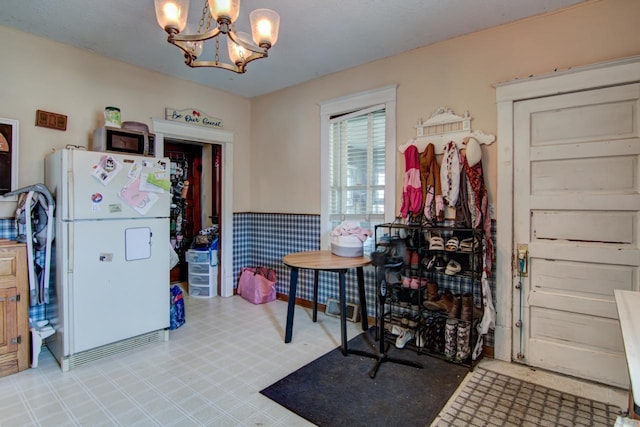 735 Broadway Ave, Wabasha, MN 55981 - dining space featuring light flooring and a chandelier