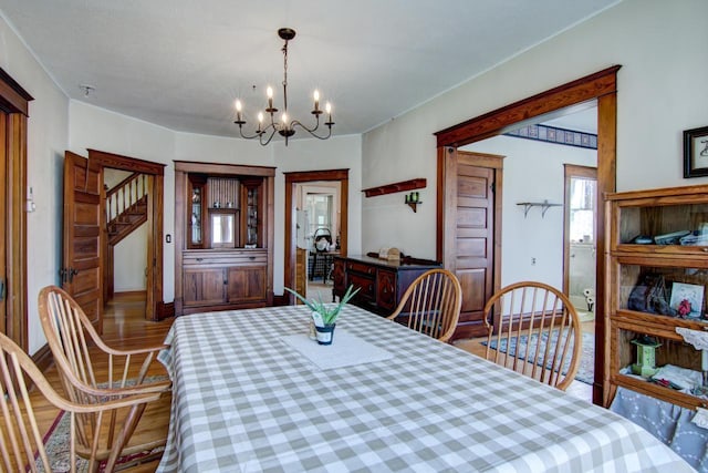 735 Broadway Ave, Wabasha, MN 55981 - dining area featuring a chandelier and wood finished floors