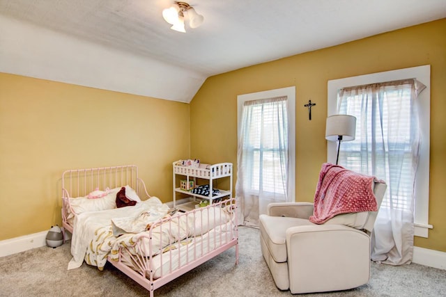 735 Broadway Ave, Wabasha, MN 55981 - carpeted bedroom featuring lofted ceiling and baseboards