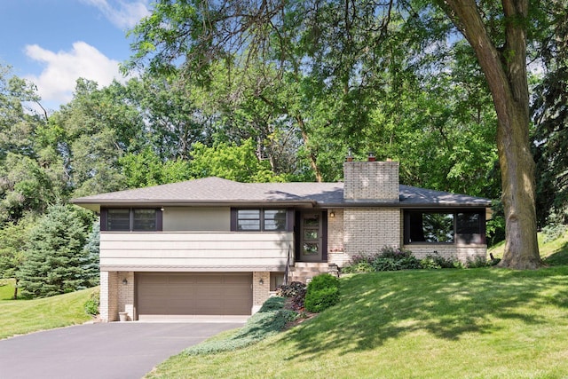 3748 Hilltop Rd, Minnetonka, MN 55305 - tri-level home featuring brick siding, a garage, a chimney, driveway, and a front lawn