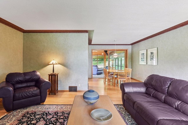 3748 Hilltop Rd, Minnetonka, MN 55305 - living room with wood finished floors, ornamental molding, and a textured wall
