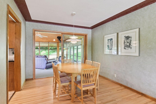 3748 Hilltop Rd, Minnetonka, MN 55305 - dining area with light wood finished floors, crown molding, and a textured wall