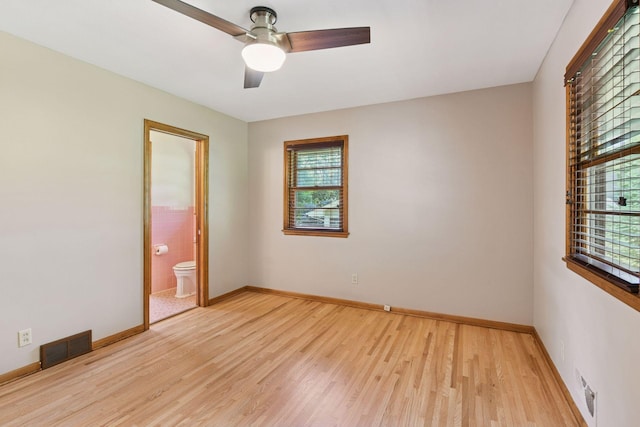 3748 Hilltop Rd, Minnetonka, MN 55305 - spare room with plenty of natural light, light wood-style flooring, and ceiling fan