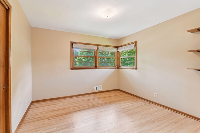 3748 Hilltop Rd, Minnetonka, MN 55305 - spare room with wood finished floors and baseboards