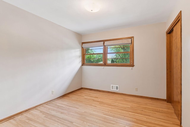 3748 Hilltop Rd, Minnetonka, MN 55305 - unfurnished bedroom featuring light wood finished floors and a closet