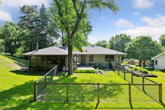 3748 Hilltop Rd, Minnetonka, MN 55305 - back of property featuring a sunroom, a fenced backyard, a patio, and roof with shingles