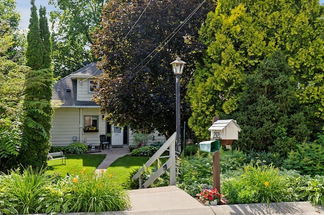 2921 Cambridge Ln, Mound, MN 55364 - view of property hidden behind natural elements with a front yard