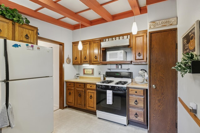 2921 Cambridge Ln, Mound, MN 55364 - kitchen featuring white appliances, brown cabinetry, light countertops, light flooring, and hanging light fixtures