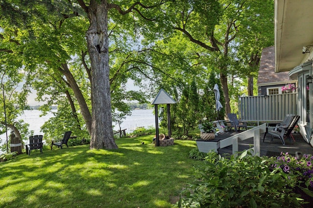 2921 Cambridge Ln, Mound, MN 55364 - view of grassy yard with a deck with water view
