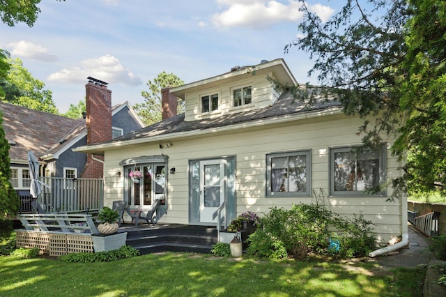 2921 Cambridge Ln, Mound, MN 55364 - rear view of house with a lawn and a wooden deck