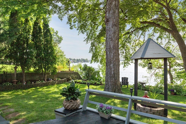 2921 Cambridge Ln, Mound, MN 55364 - view of green lawn with a deck with water view