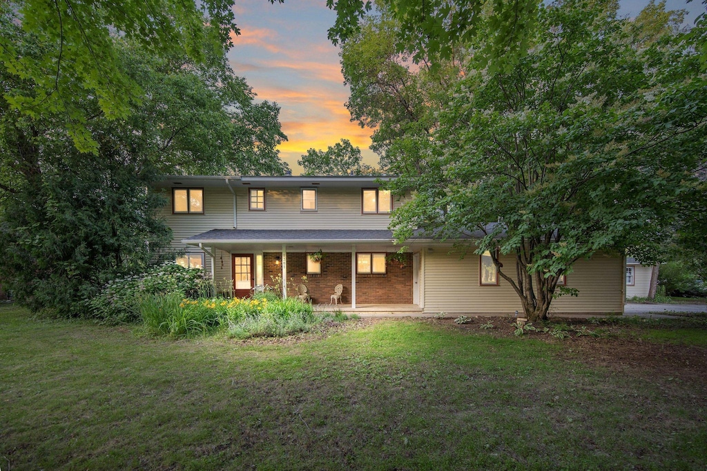 1301 Washington St, Northfield, MN 55057 - back of property featuring a yard and covered porch