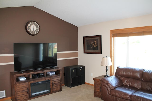 1508 6th Ave S, Sartell, MN 56377 - carpeted living area featuring vaulted ceiling and baseboards