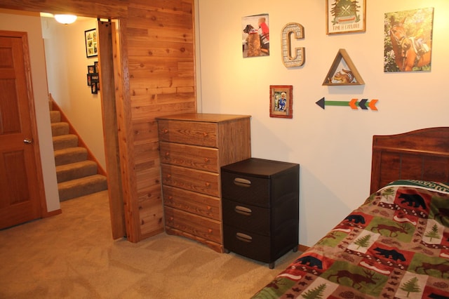 1508 6th Ave S, Sartell, MN 56377 - bedroom featuring light carpet and wood walls