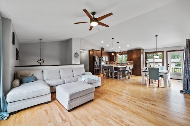 22493 Carina Ct, Farmington, MN 55024 - living room featuring vaulted ceiling, ceiling fan, light wood finished floors, and recessed lighting