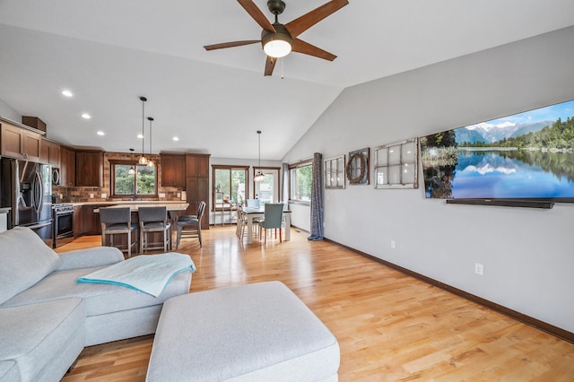 22493 Carina Ct, Farmington, MN 55024 - living room featuring lofted ceiling, ceiling fan, light wood-style floors, and recessed lighting