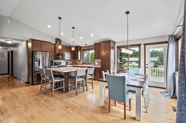 22493 Carina Ct, Farmington, MN 55024 - dining space featuring vaulted ceiling, light wood finished floors, and recessed lighting