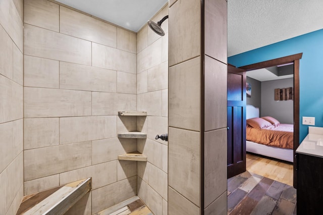 22493 Carina Ct, Farmington, MN 55024 - full bathroom with wood finished floors, ensuite bath, and tiled shower