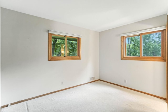 18612 Springcrest Dr, Minnetonka, MN 55345 - carpeted spare room with baseboards