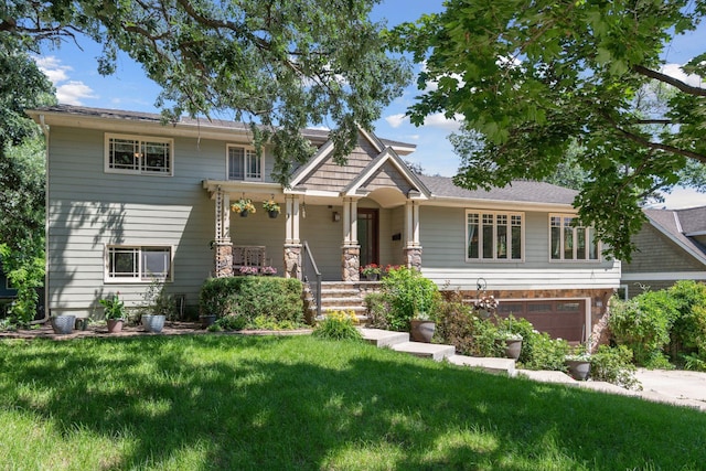 4011 Grimes Ave S, Edina, MN 55416 - craftsman house with a front lawn, stone siding, covered porch, and a garage