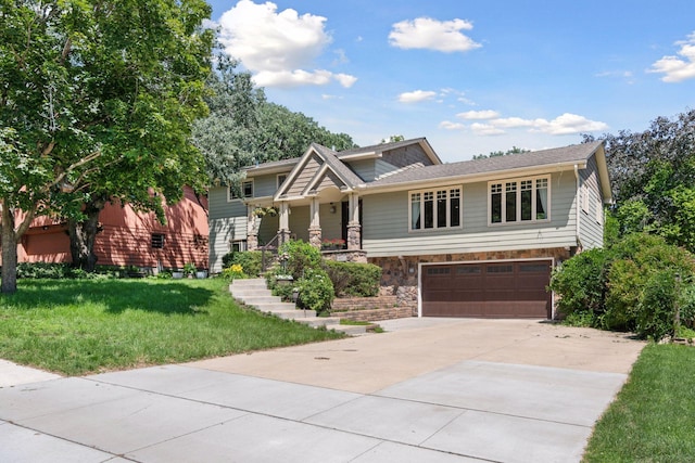 4011 Grimes Ave S, Edina, MN 55416 - craftsman-style house with driveway, a garage, a front lawn, and stone siding