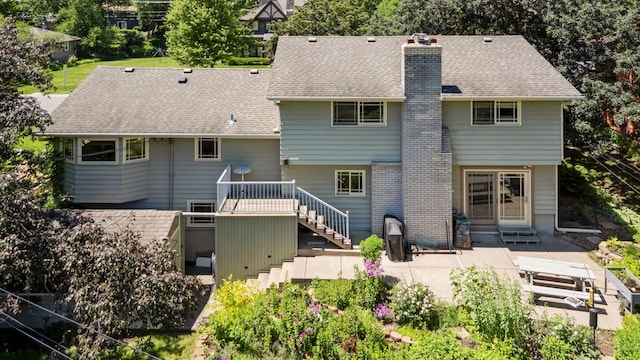 4011 Grimes Ave S, Edina, MN 55416 - rear view of property featuring a patio area, stairway, a chimney, and roof with shingles