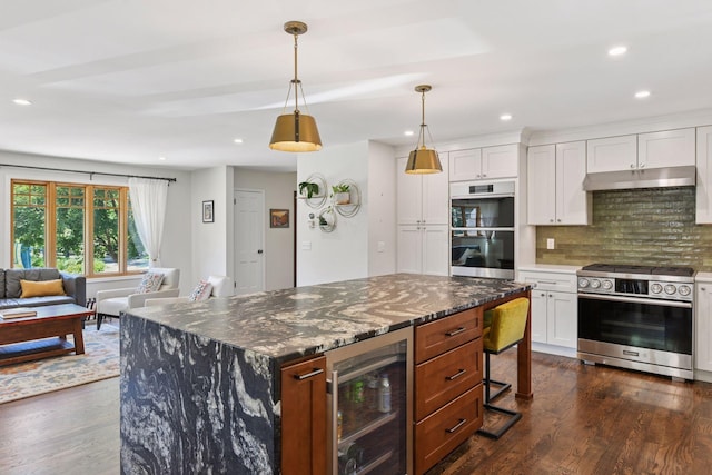 4011 Grimes Ave S, Edina, MN 55416 - kitchen featuring stainless steel appliances, beverage cooler, under cabinet range hood, tasteful backsplash, and recessed lighting