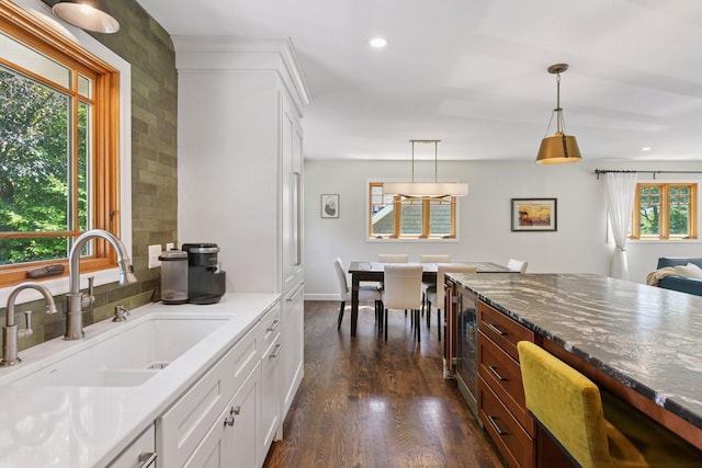 4011 Grimes Ave S, Edina, MN 55416 - kitchen with dark wood finished floors, hanging light fixtures, white cabinetry, recessed lighting, and wine cooler