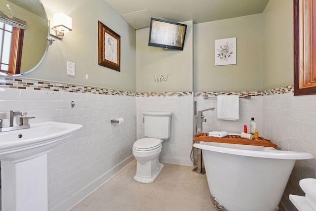 4011 Grimes Ave S, Edina, MN 55416 - bathroom with tile walls, a soaking tub, and wainscoting